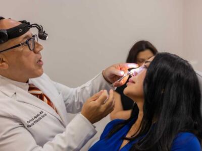 patient receiving nose treatment from Dr. Ayala